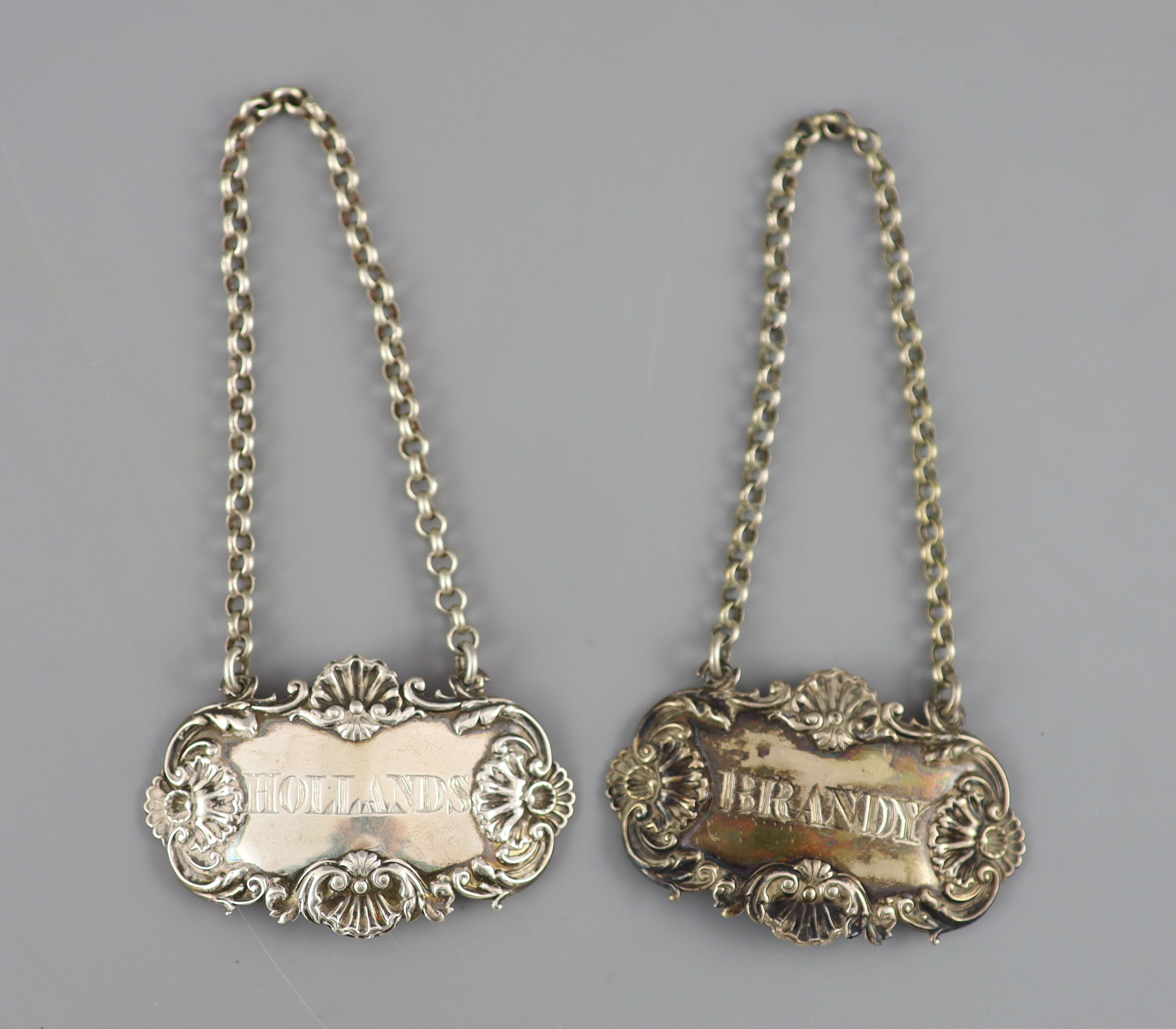 A pair of George IV silver wine labels Hollands & Brandy by Paul Storr, London, 1827, 64mm & 2 others.